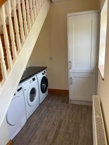 a laundry room with a washer and dryer at Molly's Self Catering Accommodation in Cavan