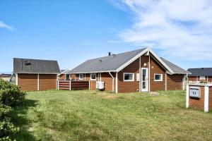 a wooden house with a large yard in front of it at 511-Lemvig-Lyngsletten-13 in Lemvig