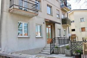 a building with stairs and balconies on it at MB House in Sistiana
