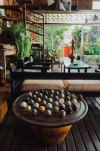 a bowl of balls on a table in a room at Le Karthala in Antananarivo