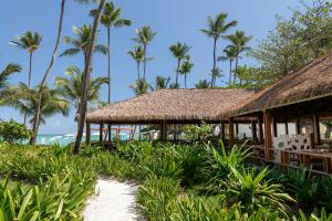 a resort on the beach with palm trees at Grand Palladium Select Bávaro - All Inclusive in Punta Cana