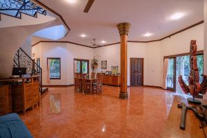 a large living room with a table and chairs at Villa Sky Dancer - Bali in Amed