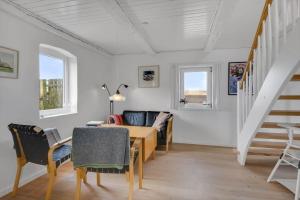 a living room with a table and a couch at 526-Lemvig-Rubyvej-21 in Lemvig