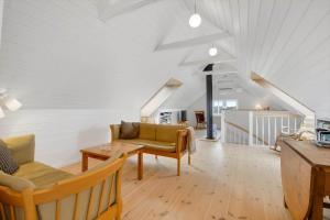 a living room with a couch and a table at 526-Lemvig-Rubyvej-21 in Lemvig