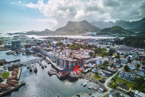 an aerial view of a city with boats in a harbor at Svolvær Panorama City Suite in Svolvær