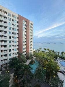 an aerial view of a building with a resort at Apartment Borneo Bay City - AH Property Indonesia in Balikpapan