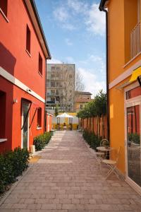 a cobblestone alley between two buildings in a city at Residence Corte Bizantina in Ravenna