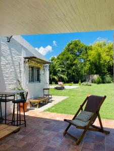 a patio with a table and chairs on a patio at Casa Sua in Victoria
