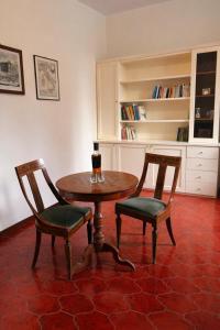 a table and two chairs in a living room at Villa Magnolia in Vicenza