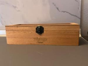 a wooden box sitting on top of a table at Velvet studios Ioanna in Naousa