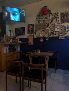 a dining room with a table and two chairs at Happy Hope Khao San in Bangkok