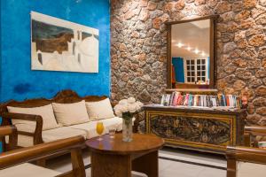 A kitchen or kitchenette at Antinea Suites Hotel & Spa