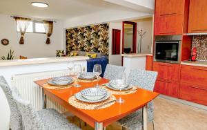 a kitchen and dining room with a table and chairs at Oleander Garden in Alexandroupoli