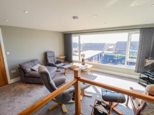 a living room with a large window at Seascape in Hunstanton