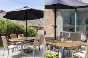 a table and chairs with an umbrella on a patio at 1165-Romo-Gulirisvej-841 in Høm