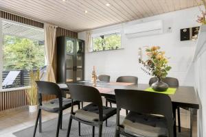 a dining room with a table and chairs at 0167-Romo-Julianehab-12 in Høm