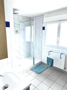 a bathroom with a shower and a sink at Maison Malo Plage in Dunkerque +34 photos