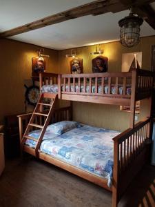 a bedroom with two bunk beds in a room at Villa da Winci in Odesa