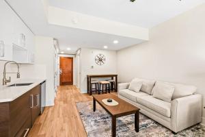 a living room with a couch and a table at Lasata #3112 in Destin