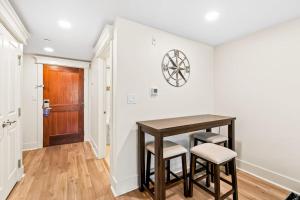 a dining room with a table and two stools at Lasata #3112 in Destin +16 photos