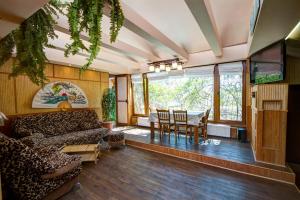 a living room with a couch and a table at Villa da Winci in Odesa