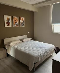 Giường trong phòng chung tại STAY COMODO Rooms