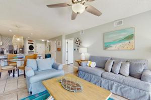 a living room with a couch and a table at Maravilla 1114 in Destin