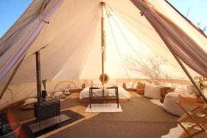 a tent with a living room with a tv in it at Osada na hůrce in Hustopeče