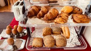 a plastic container filled with different types of bread and pastries at Hotel Heynen in Valkenburg