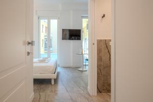 a room with a bed and a living room at Italianflat - Vandom 2 Duomo Luxury Rooms Foresteria Lombarda in Milan