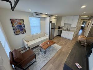 a living room with a couch and a table at The Global Getaway in St. Charles +9 photos