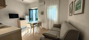 a living room with a couch and a table at Liberato Puglia Vacanze in Peschici