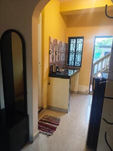 a kitchen with a sink and a counter top at Carvalhos Regina 100 mtrs Patnem beach in Canacona +24 photos