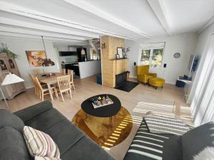 a living room with a couch and a table at 0172-Romo-Rabjergvej-84 in Høm