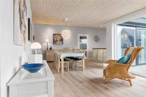 a kitchen and dining room with a table and chairs at 0347-Romo-Vestergade-353 in Høm
