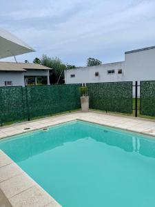 a swimming pool in the backyard of a house at Complejo Juan Pablo in Colón +11 photos
