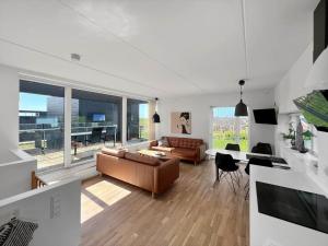 a living room with a couch and a table at 0277-Romo-Hollaenderstraedet-38 in Høm