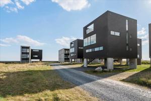 a black house on the side of a road at 0277-Romo-Hollaenderstraedet-38 in Høm