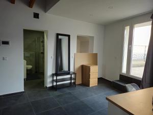 a room with a bathroom with a sink and a mirror at Roomies Luxembourg Centre Gare in Luxembourg
