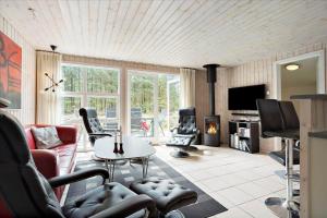 a living room with a couch and a table at 0424-Romo-Sonderstrandvej-15 in Høm