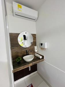 a bathroom with a sink and a mirror at Hotel Boutique Primavera Beach in Necoclí