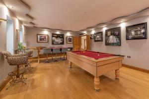 a room with a pool table and a bar at Hamble House in Southampton