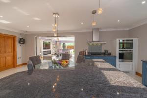 a kitchen with a table and a dining room at Hamble House in Southampton