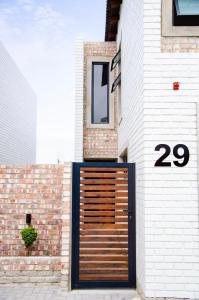 a wooden door on the side of a building at Rustic Retreat in Swakopmund