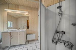a bathroom with a shower and a sink at 0223-Romo-Sonderstrandvej-12 in Høm