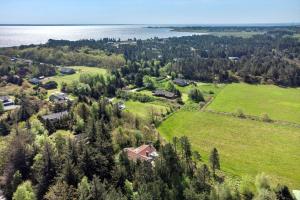 an aerial view of a house on a hill near the water at 0252-Romo-Kromosevej-6 in Høm