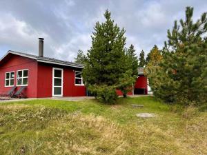 a red house with trees in front of it at 0210-Romo-Vestergardsvej-10 in Høm