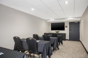 a conference room with tables and chairs and a screen at Best Western Plus Gilbert/Mesa in Mesa +25 photos