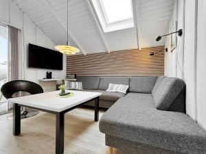 a living room with a couch and a table at 0386-Romo-Vestergade-3-Ap-16 in Høm