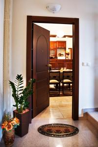 a door leading into a kitchen with a dining room at Agria Lux Apartment - Pelion - Volos in Agria